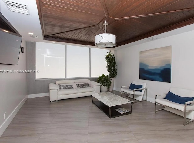 living area featuring wooden ceiling, baseboards, and visible vents