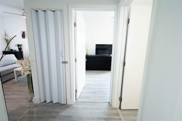 hallway with wood finished floors