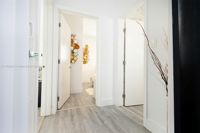 corridor with light wood finished floors