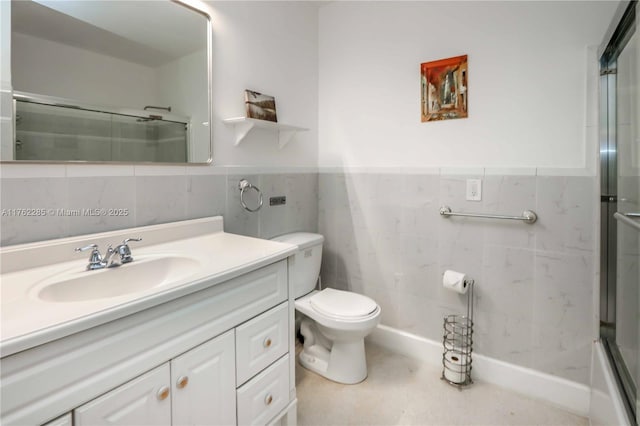 952 Hollywood Blvd, Hollywood, FL 33019 - bathroom featuring vanity, wainscoting, tile walls, toilet, and a shower with door