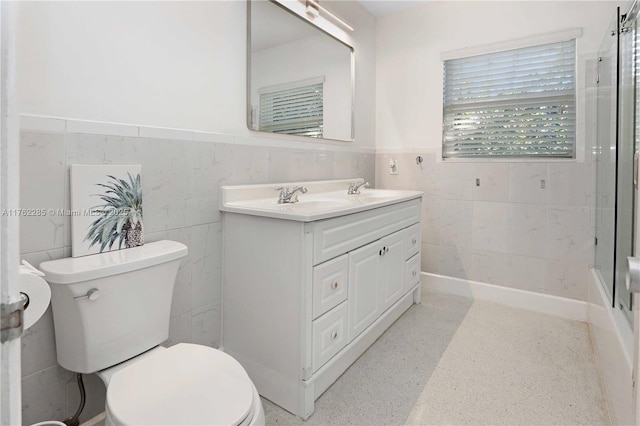 952 Hollywood Blvd, Hollywood, FL 33019 - full bathroom with double vanity, toilet, wainscoting, and a sink