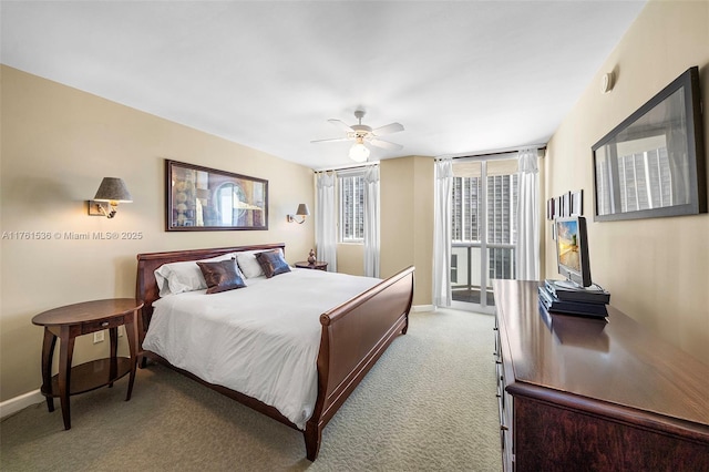 bedroom featuring baseboards, carpet, and a ceiling fan