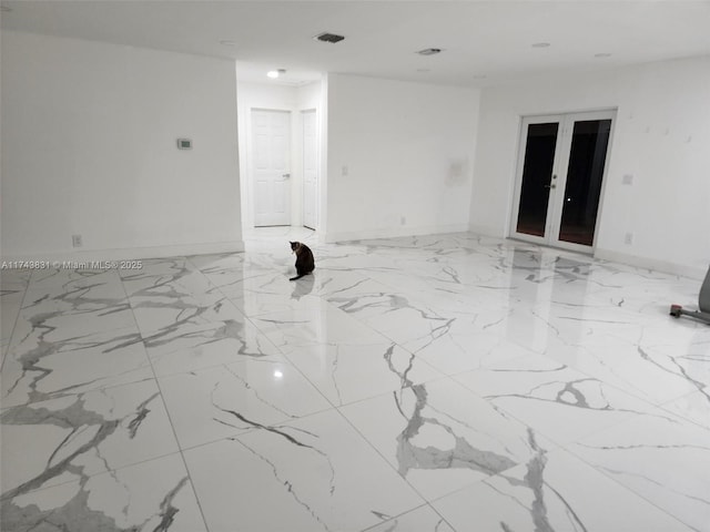 unfurnished room with visible vents, marble finish floor, french doors, and baseboards