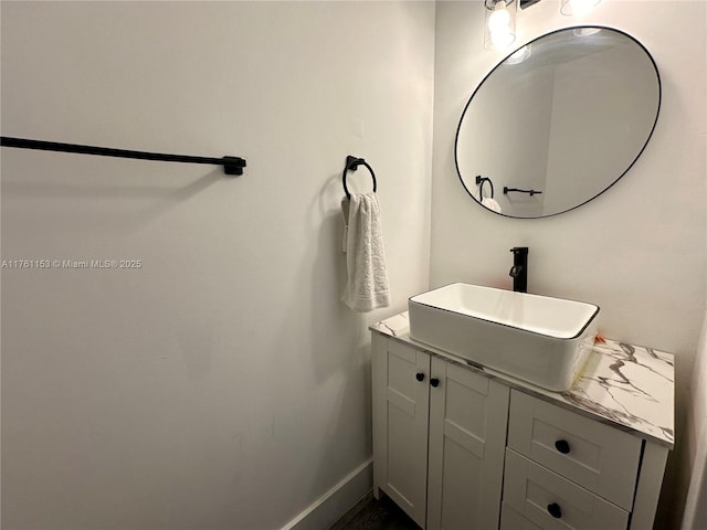 bathroom featuring vanity and baseboards