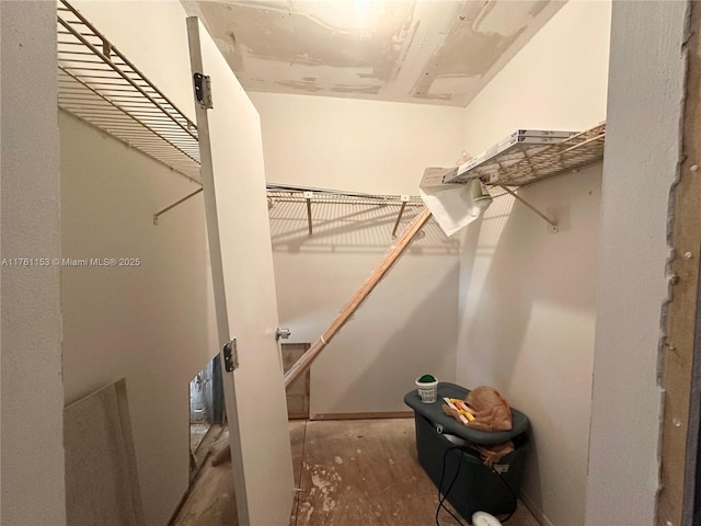 spacious closet with wood finished floors