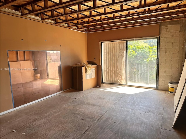 interior space with concrete block wall