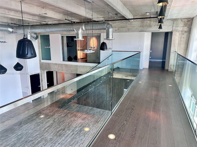 corridor featuring wood finished floors