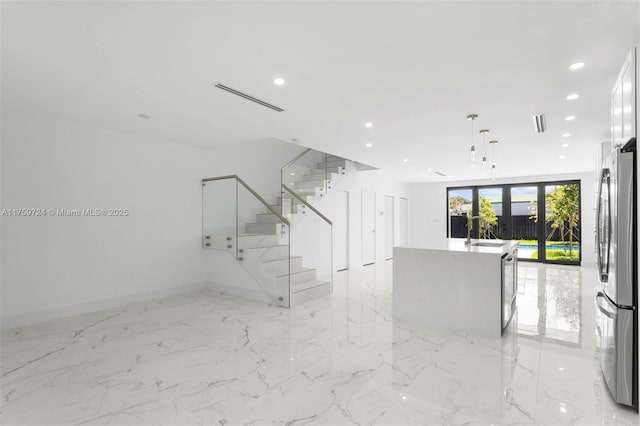 interior space featuring stairway, recessed lighting, visible vents, and a sink