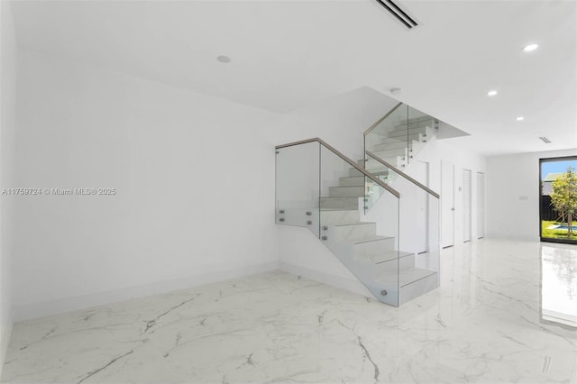 stairs featuring recessed lighting, baseboards, and marble finish floor