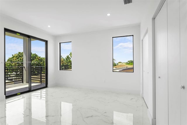 unfurnished bedroom featuring recessed lighting, marble finish floor, baseboards, and access to outside