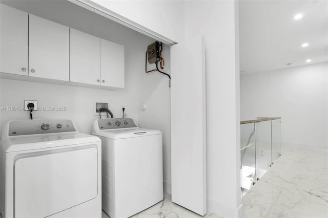 laundry area featuring baseboards, recessed lighting, cabinet space, marble finish floor, and independent washer and dryer