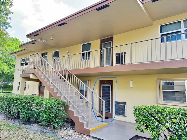 view of property with stairs