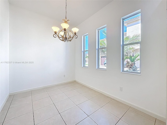 2217 SW Newport Isles Blvd, Port St Lucie, FL 34953 - unfurnished room featuring a chandelier and light tile patterned flooring