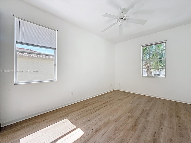 2217 SW Newport Isles Blvd, Port St Lucie, FL 34953 - spare room featuring wood finished floors and a ceiling fan