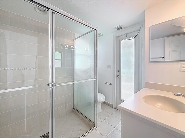 2217 SW Newport Isles Blvd, Port St Lucie, FL 34953 - full bathroom with a shower stall, vanity, and tile patterned floors