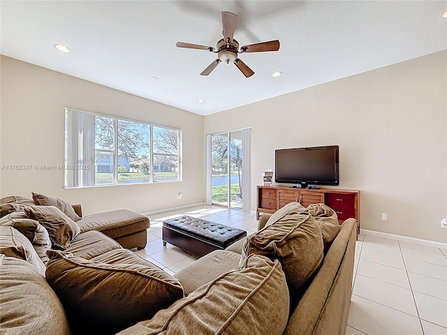 living room featuring a ceiling fan, light tile patterned floors, recessed lighting, and baseboards