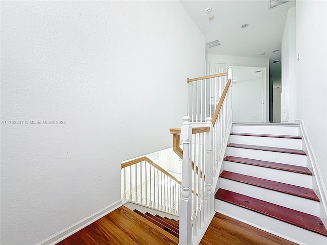 2217 SW Newport Isles Blvd, Port St Lucie, FL 34953 - stairs with wood finished floors and baseboards