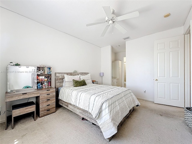 bedroom with baseboards, a ceiling fan, visible vents, and light carpet