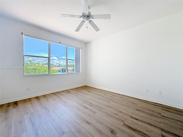 2217 SW Newport Isles Blvd, Port St Lucie, FL 34953 - spare room featuring wood finished floors and ceiling fan
