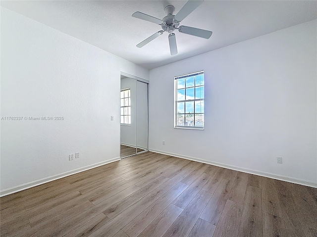 2217 SW Newport Isles Blvd, Port St Lucie, FL 34953 - empty room featuring wood finished floors and ceiling fan