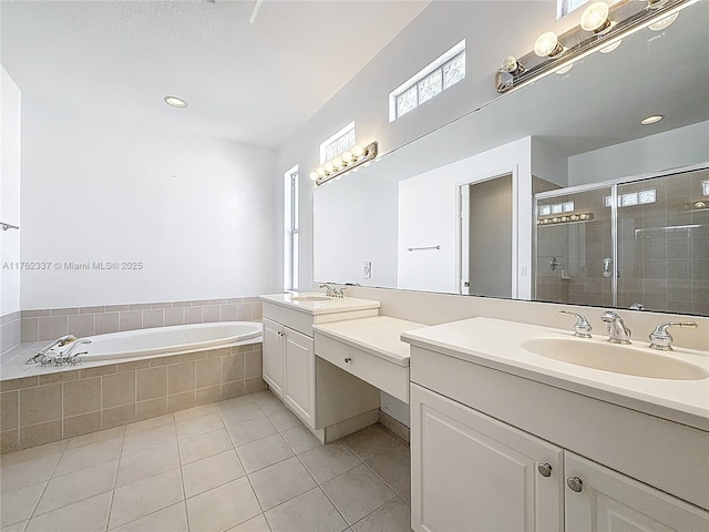 2217 SW Newport Isles Blvd, Port St Lucie, FL 34953 - bathroom featuring vanity, tile patterned flooring, a stall shower, and a bath