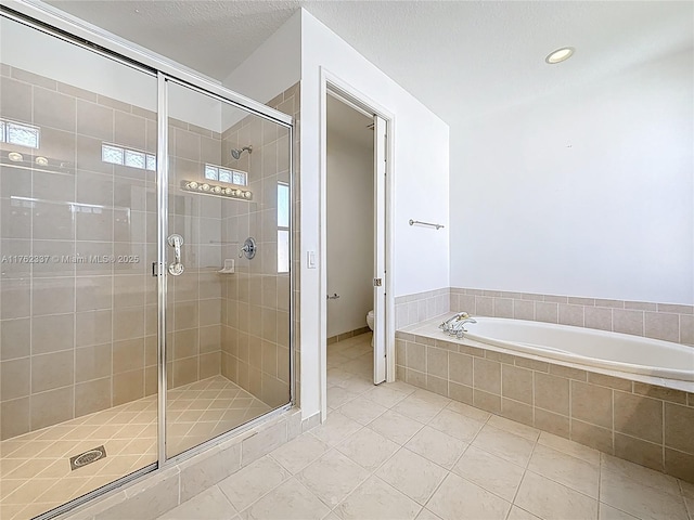 2217 SW Newport Isles Blvd, Port St Lucie, FL 34953 - full bath with tile patterned floors, a shower stall, a garden tub, and recessed lighting
