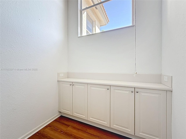 2217 SW Newport Isles Blvd, Port St Lucie, FL 34953 - detailed view of wood finished floors and baseboards