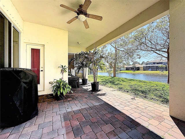 2217 SW Newport Isles Blvd, Port St Lucie, FL 34953 - view of patio / terrace featuring a water view and ceiling fan