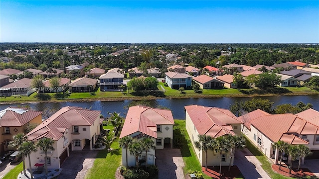 bird's eye view with a residential view and a water view