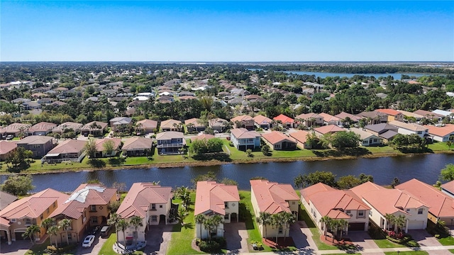 aerial view with a residential view and a water view