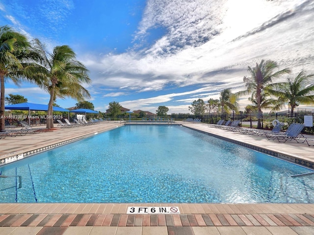 2217 SW Newport Isles Blvd, Port St Lucie, FL 34953 - community pool with a patio area