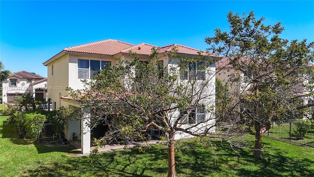 2217 SW Newport Isles Blvd, Port St Lucie, FL 34953 - back of property with stucco siding and a tile roof