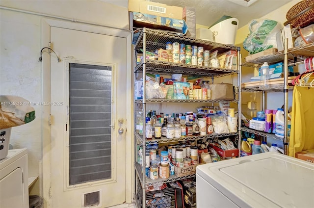 pantry featuring visible vents and washer and dryer