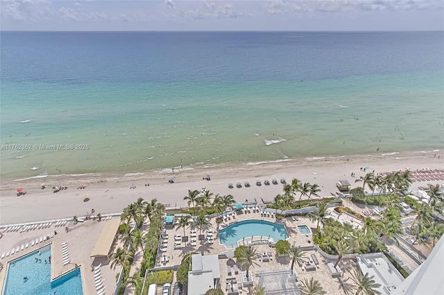 aerial view with a beach view and a water view