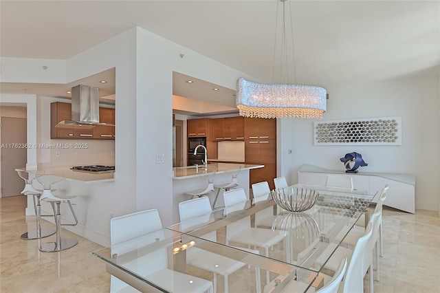 dining area with recessed lighting and baseboards