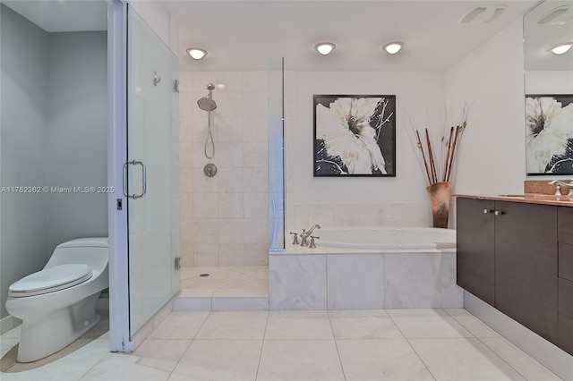 full bathroom with a stall shower, toilet, vanity, and a garden tub