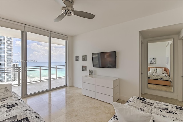 bedroom with access to outside, floor to ceiling windows, a ceiling fan, and baseboards