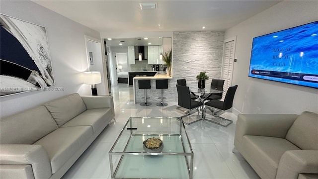 living room with tile patterned flooring and visible vents