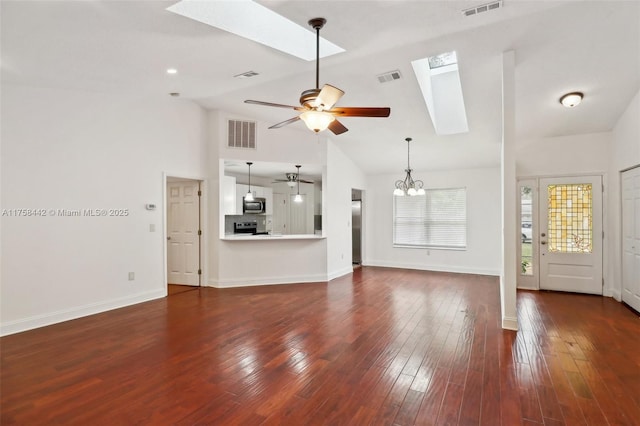 unfurnished living room featuring visible vents, a skylight, and wood-type flooring