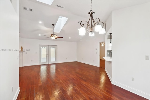 unfurnished living room featuring visible vents, dark wood-style floors, a skylight, and french doors