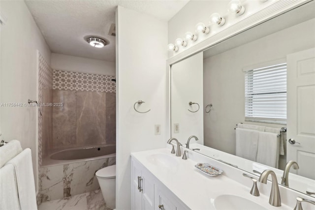 bathroom featuring a sink, bathtub / shower combination, a textured ceiling, toilet, and marble finish floor