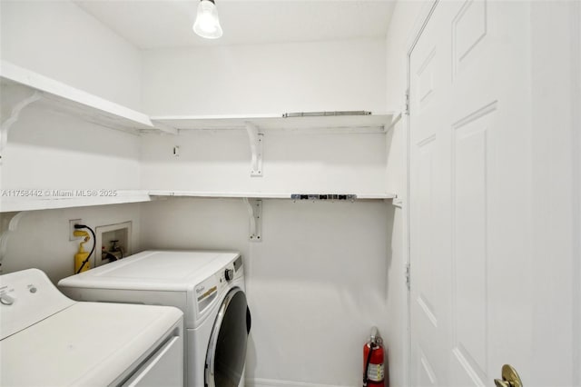 washroom with laundry area and washer and clothes dryer