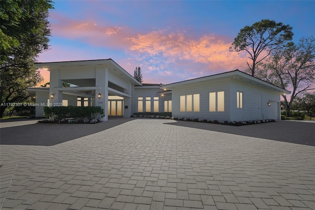 view of front of home with decorative driveway