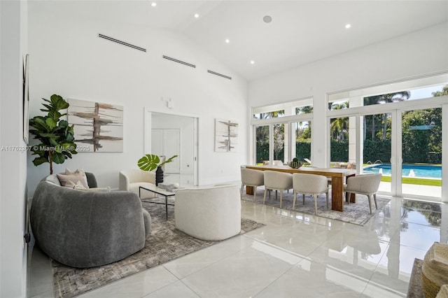 living area featuring recessed lighting, french doors, and high vaulted ceiling