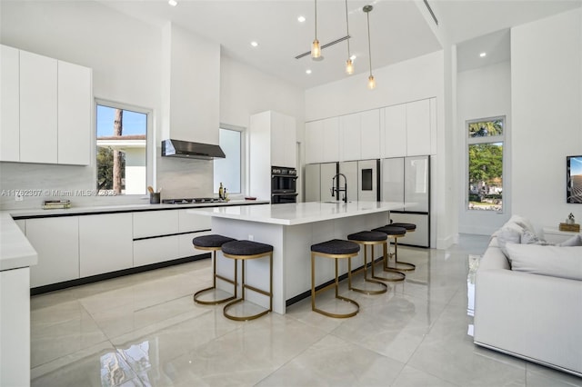 kitchen with modern cabinets and a high ceiling