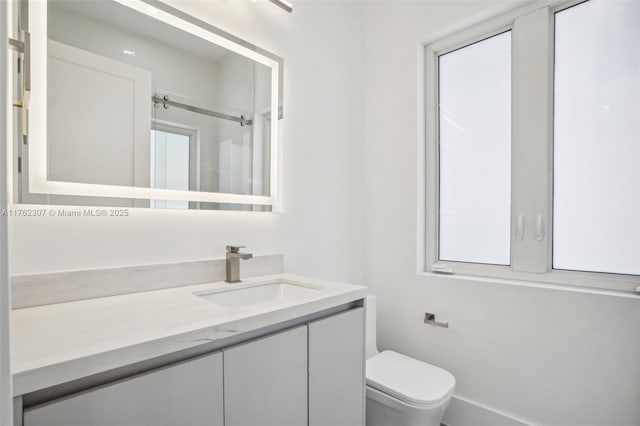 full bathroom featuring a shower, toilet, and vanity