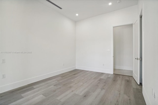 spare room featuring recessed lighting, visible vents, baseboards, and light wood finished floors