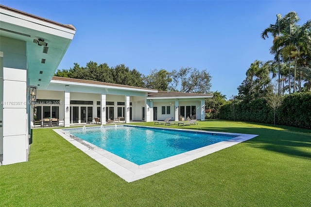 view of pool with a fenced in pool and a yard