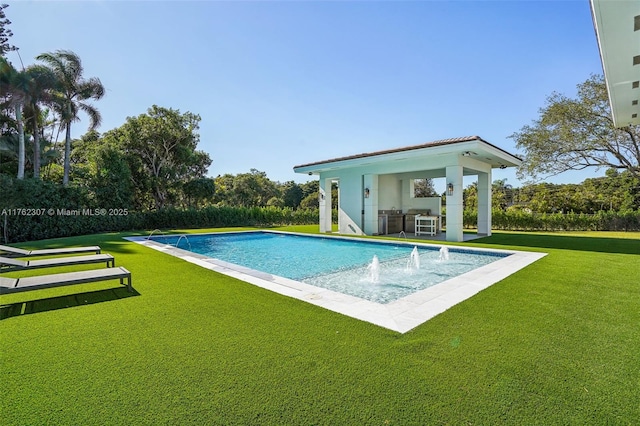 view of pool featuring a fenced in pool and a yard