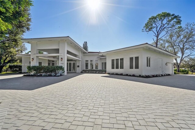 exterior space featuring decorative driveway